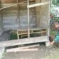 Keterangan Foto: Babinsa Koramil 08/SN Serda Suprianto bersama warga melaksanakan karya bhakti membantu pembangunan kios,(6/72026).(Dok/Ist)
