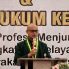 Asisten I Sekdakab Aceh Besar Farhan AP mewakili Bupati Muharram Idris membuka Pelantikan Pengurus IDI Cabang Aceh Besar Periode 2026-2029 dan Seminar Hukum Kesehatan di Orion Hall, Darul Imarah, Sabtu (12/9/2026). Foto: Dok. MC Aceh Besar