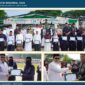 Bupati Aceh Tengah Haili Yoga menyerahkan piagam penghargaan kepada perwakilan Dayah Al Hasaniyah Al Aziziyah yang meraih Juara I dalam lima kategori kebersihan pada peringatan Hari Santri Nasional 2026 di Takengon.Kamis,(22/10/26).foto:Doc.Rizkan/Acehnow.com